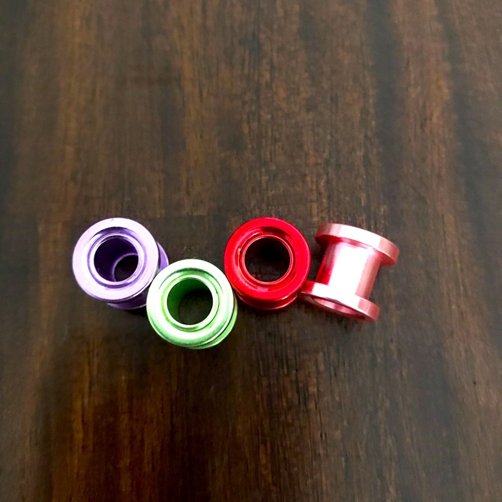 Colored steel barrels for stretched ears